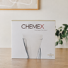 CHEMEX product packaging on a wooden surface with a blurred background